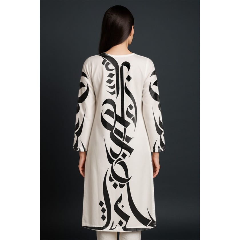 Back view of a white kurta with large black Arabic calligraphy strokes