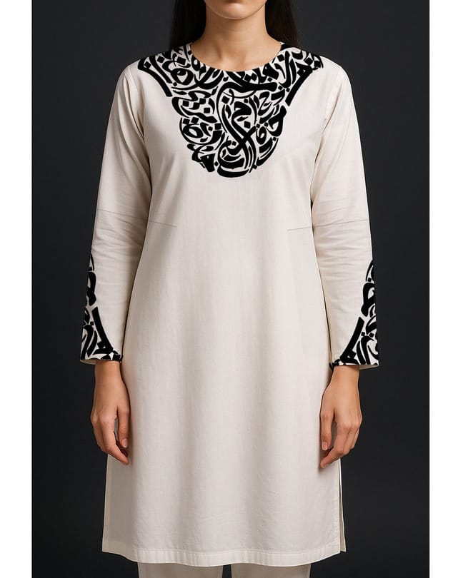 Model in a white kurta with black calligraphic embroidery at the neckline